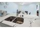 Kitchen sink featuring marble countertops and stainless steel appliances, great for a chef at 215 Medallion Blvd # G, Madeira Beach, FL 33708