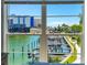 Amazing view of boat docks and buildings through a window at 215 Medallion Blvd # G, Madeira Beach, FL 33708