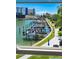 Window view of boat docks, blue umbrellas, and buildings at 215 Medallion Blvd # G, Madeira Beach, FL 33708
