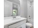 Bright bathroom with white cabinets, countertop, shower, and toilet at 3142 Torta Ct, Bradenton, FL 34211