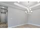 Dining area featuring modern lighting, with neutral wall color, and hardwood floor at 3142 Torta Ct, Bradenton, FL 34211