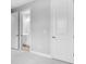 Hallway with doors leading to a bathroom at 3142 Torta Ct, Bradenton, FL 34211