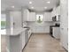 Bright kitchen with stainless steel appliances, sleek counters, and light wood-look floors at 3142 Torta Ct, Bradenton, FL 34211