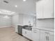 Modern kitchen with stainless steel appliances, a center island, and plenty of cabinet space at 3142 Torta Ct, Bradenton, FL 34211