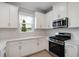 Close up of a bright kitchen with stainless steel appliances and plenty of storage at 3142 Torta Ct, Bradenton, FL 34211