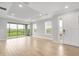 Open living area with recessed lighting, sliding glass doors, and tile flooring at 3142 Torta Ct, Bradenton, FL 34211