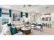 Bright living room showcasing stylish furniture, with a view into the modern kitchen and well-lit interior at 3142 Torta Ct, Bradenton, FL 34211
