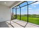 Screened-in patio featuring brick flooring and a picturesque view at 3142 Torta Ct, Bradenton, FL 34211