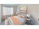 Comfortable bedroom with neutral tones, natural light, and stylish décor create a relaxing atmosphere at 6158 Daerr Ridge St, Zephyrhills, FL 33542