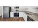 Modern kitchen featuring stainless steel appliances, granite countertops, and ample cabinet space at 6162 Daerr Ridge St, Zephyrhills, FL 33542