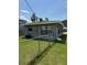 This home includes a backyard with a full fence and green grass at 845 18Th S Ave, St Petersburg, FL 33705