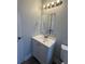 Modern bathroom with vanity sink, new fixtures, and updated lighting at 845 18Th S Ave, St Petersburg, FL 33705