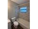 Updated bathroom features a shower-tub combo with stylish tile and new fixtures at 845 18Th S Ave, St Petersburg, FL 33705