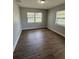 Inviting bedroom with modern flooring and bright natural light from dual windows at 845 18Th S Ave, St Petersburg, FL 33705