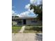 Charming single-story home featuring a covered porch, well-maintained lawn, and neat landscaping at 845 18Th S Ave, St Petersburg, FL 33705