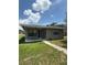 Charming single-story home featuring a covered porch, well-maintained lawn, and neat landscaping at 845 18Th S Ave, St Petersburg, FL 33705