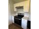 Modern kitchen with stainless steel appliances and sleek white cabinets at 845 18Th S Ave, St Petersburg, FL 33705