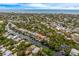 Scenic aerial view of a waterfront neighborhood with lush greenery, canals, and direct access to the ocean at 5108 Saint Albans Ave, Siesta Key, FL 34242