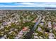 Stunning aerial view of waterfront homes, showcasing a neighborhood with private docks and access to the ocean at 5108 Saint Albans Ave, Siesta Key, FL 34242