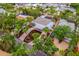 High aerial view of the home featuring lush landscaping, a private pool, and a circular driveway at 5108 Saint Albans Ave, Siesta Key, FL 34242
