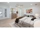 Stylishly furnished bedroom with a walk-in closet, neutral tones and natural light creates a serene atmosphere at 5108 Saint Albans Ave, Siesta Key, FL 34242