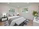 Inviting bedroom with large windows, stylish decor, and a comfortable bed creates a relaxing retreat at 5108 Saint Albans Ave, Siesta Key, FL 34242