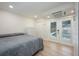 Serene bedroom with French doors overlooking the pool area at 5108 Saint Albans Ave, Siesta Key, FL 34242