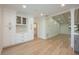 Dining area with white cabinets, modern hardware, and seamless flow to the living space at 5108 Saint Albans Ave, Siesta Key, FL 34242