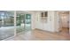Well-lit dining area with built-in cabinets and direct access to the pool area through sliding doors at 5108 Saint Albans Ave, Siesta Key, FL 34242