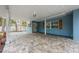 Inviting covered front entryway showcasing a patterned brick floor, wood shutters, and stylish overhead lighting at 5108 Saint Albans Ave, Siesta Key, FL 34242