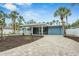 Charming single-story home with a covered carport, updated landscaping, and a brick paver driveway at 5108 Saint Albans Ave, Siesta Key, FL 34242