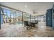 Enclosed outdoor swimming pool with travertine tile and surrounded by comfortable seating, perfect for relaxing at 5108 Saint Albans Ave, Siesta Key, FL 34242