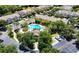 An aerial view of the neighborhood community pool surrounded by lush landscaping and ample parking at 10124 Westpark Preserve Blvd, Tampa, FL 33625