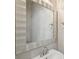 Bathroom vanity features a modern mirror with a sink, faucet, and convenient towel rings at 10124 Westpark Preserve Blvd, Tampa, FL 33625
