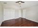 Large bedroom features hardwood floors, closet, and natural light that pours in through windows at 10124 Westpark Preserve Blvd, Tampa, FL 33625