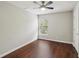 Bedroom with ceiling fan, hardwood floor and large window at 10124 Westpark Preserve Blvd, Tampa, FL 33625