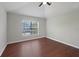 Bright bedroom with beautiful hardwood floors and a window providing natural light at 10124 Westpark Preserve Blvd, Tampa, FL 33625