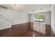 Spacious living room features hardwood floors, chandelier, and sliding glass doors to outdoor patio at 10124 Westpark Preserve Blvd, Tampa, FL 33625