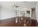 Inviting living room features hardwood floors, bright windows and a staircase to the upper level at 10124 Westpark Preserve Blvd, Tampa, FL 33625