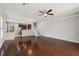 Spacious living room features hardwood floors that lead to a cozy kitchen and staircase at 10124 Westpark Preserve Blvd, Tampa, FL 33625