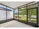 Screened patio overlooking the pond and backyard at 10124 Westpark Preserve Blvd, Tampa, FL 33625