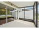 Screened patio with sliding glass doors and view of the backyard at 10124 Westpark Preserve Blvd, Tampa, FL 33625