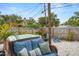 Backyard oasis with a hot tub, comfortable seating, and a serene atmosphere, perfect for outdoor relaxation and gatherings at 135 Florida Blvd, Crystal Beach, FL 34681