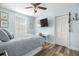 Light and airy bedroom featuring a cozy bed, modern decor, and ample closet space, creating a relaxing retreat at 135 Florida Blvd, Crystal Beach, FL 34681