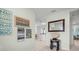 Inviting foyer with tile flooring, coastal decor, and open view to dining and kitchen areas at 135 Florida Blvd, Crystal Beach, FL 34681
