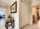 Hallway with tile flooring, closet space, and access to a bathroom at 135 Florida Blvd, Crystal Beach, FL 34681