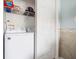 Functional laundry area equipped with modern appliances and storage solutions, adding convenience to everyday living at 135 Florida Blvd, Crystal Beach, FL 34681