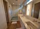 Luxurious bathroom with a double vanity, designer mirrors, and a modern glass-enclosed shower at 2408 Nassau St, Sarasota, FL 34231