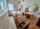 Open floor plan: dining area with table, modern chairs, and bench seating at 2408 Nassau St, Sarasota, FL 34231
