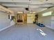 Spacious two-car garage with epoxy floors and ample storage space for vehicles and equipment at 2408 Nassau St, Sarasota, FL 34231